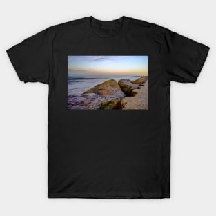 Close up of rocks and boulders protecting the cliffs on the Norfolk coast T-Shirt